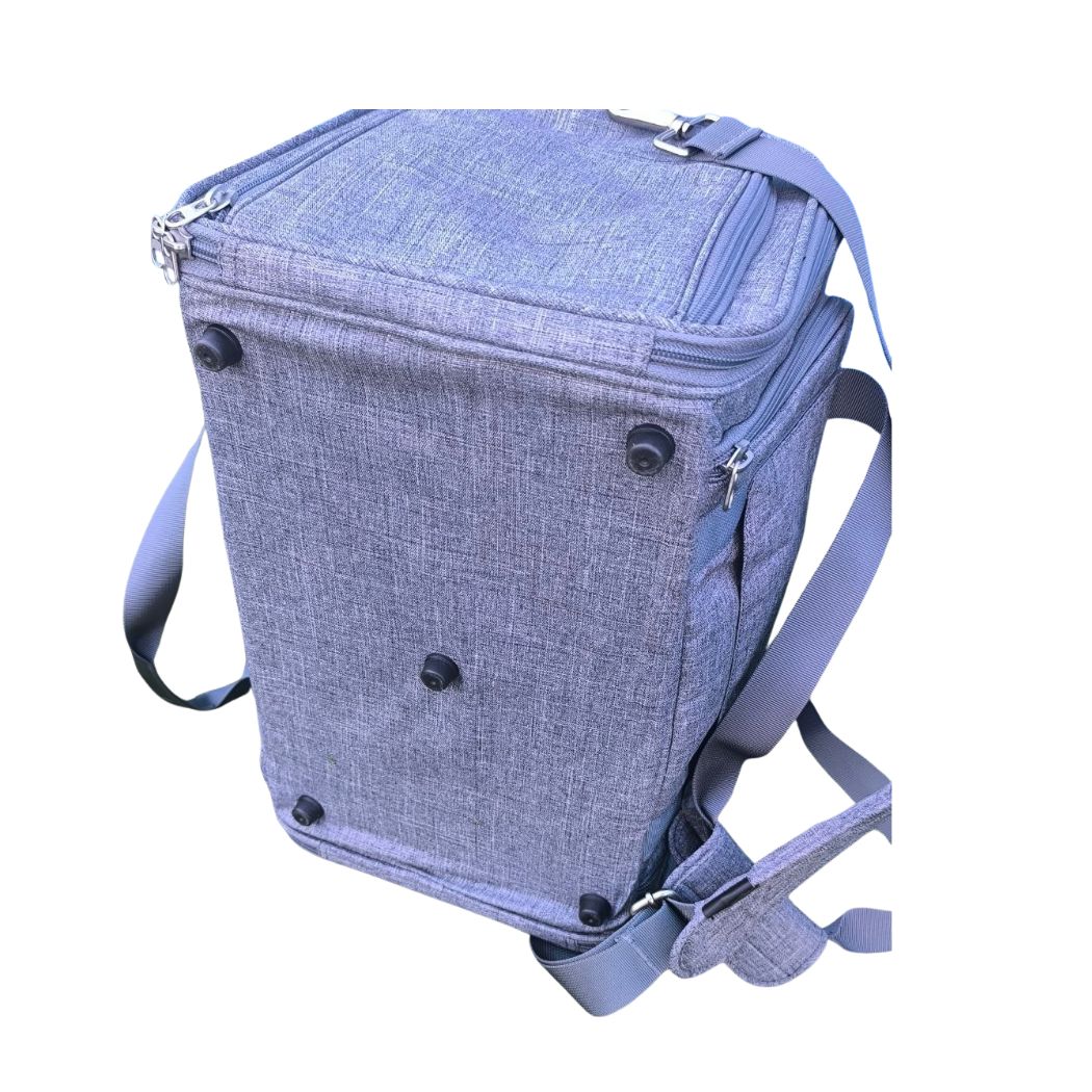 Nordvik carrier bag shown with the removable floor panel and the shoulder strap