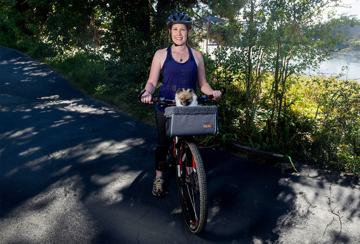 With a dog on a bike